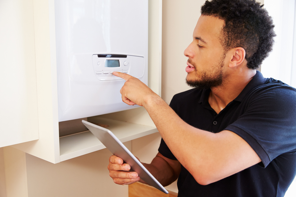 Engineer doing service on boiler
