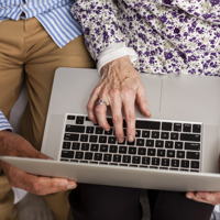 senior couple from above using laptop