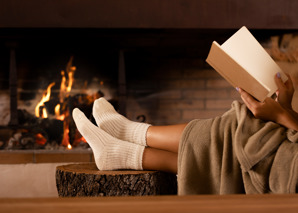 Feet in front of lit fire.