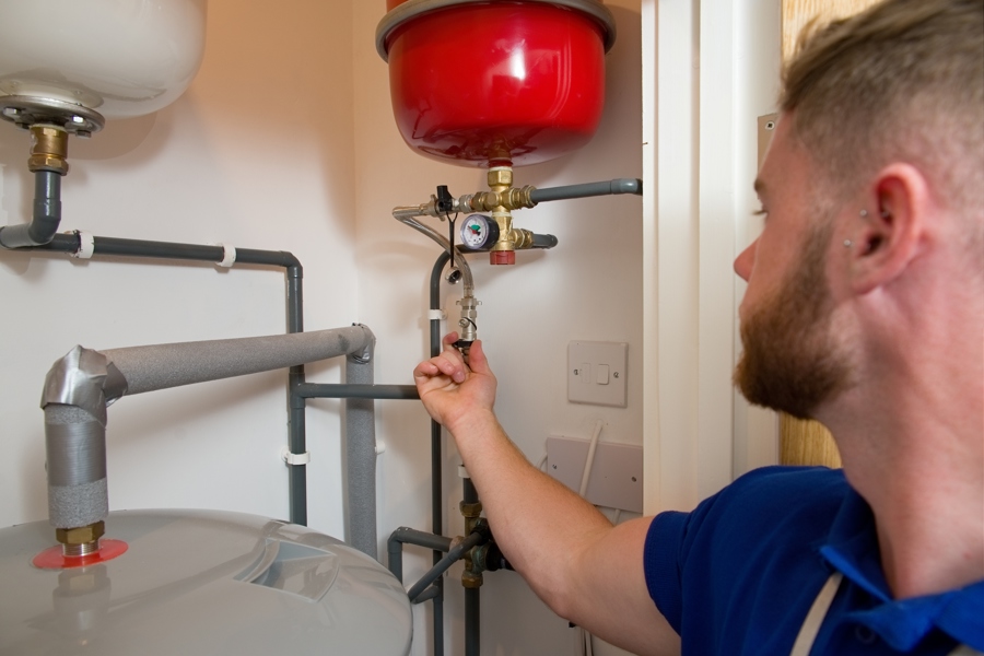 Engineer working on heating system.